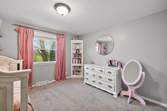 bedroom featuring baseboards, light colored carpet, and visible vents