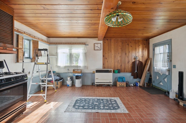miscellaneous room with brick patterned floor, wood walls, and wood ceiling