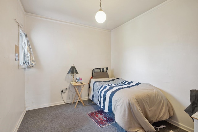 bedroom with carpet floors, crown molding, and baseboards