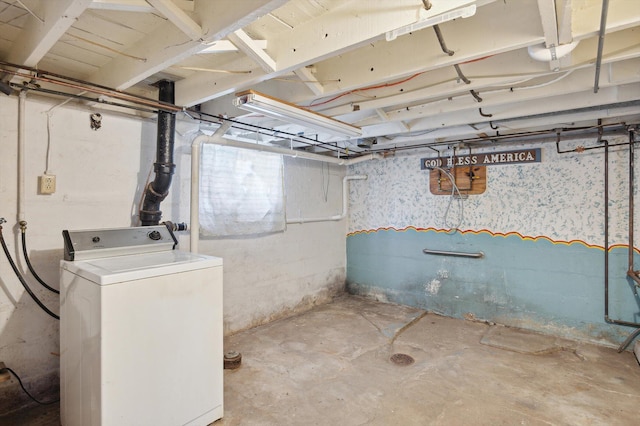 unfinished basement featuring washer / dryer