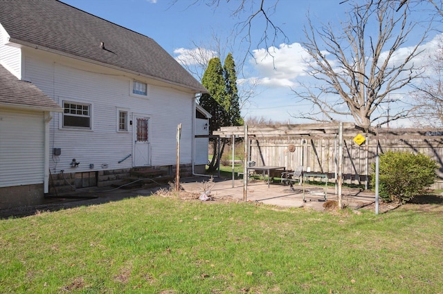view of yard featuring entry steps, a patio area, and fence