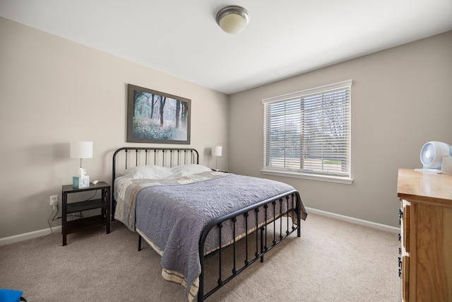 bedroom featuring baseboards and carpet floors