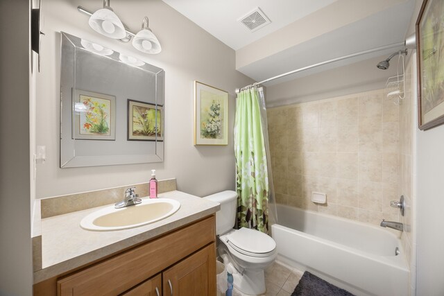 full bath featuring tile patterned floors, toilet, visible vents, shower / bath combo with shower curtain, and vanity