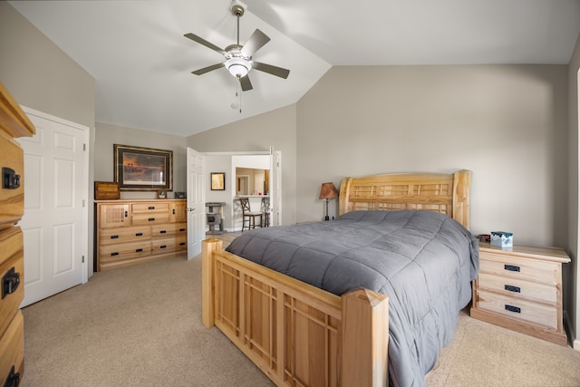 bedroom featuring lofted ceiling, a ceiling fan, and light carpet