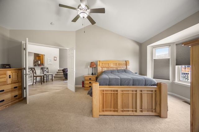 bedroom featuring ceiling fan, lofted ceiling, carpet flooring, and baseboards