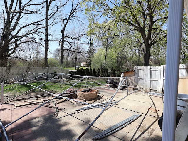 view of patio / terrace featuring a fenced backyard and a fire pit