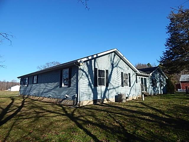 view of property exterior featuring a yard