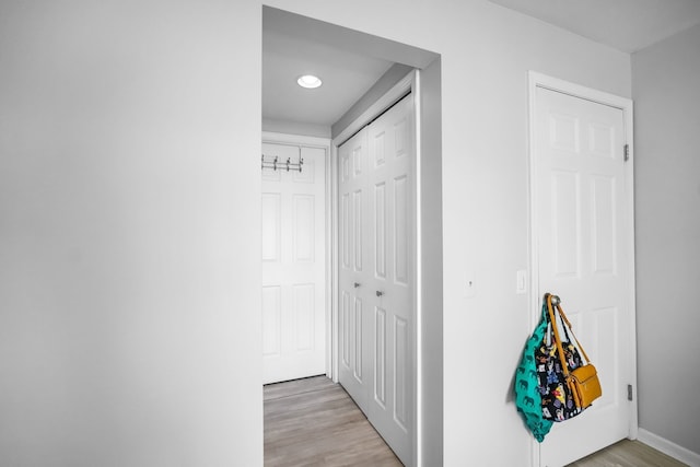3553 Port Cove Dr Unit 37, Waterford, MI 48328 - corridor with baseboards and light wood finished floors
