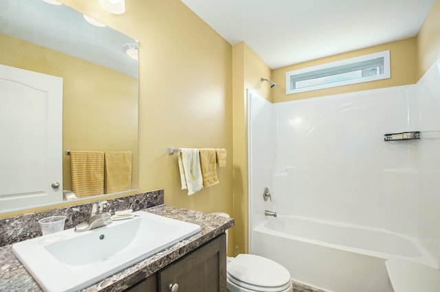 bathroom with vanity, toilet, and shower / washtub combination