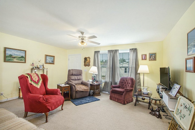 living room with carpet floors and a ceiling fan