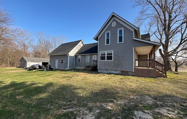 back of property featuring a lawn and covered porch
