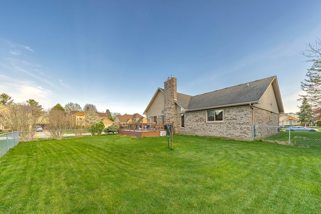 view of yard with a fenced backyard and a deck