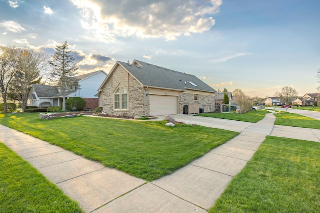 view of front of house with brick siding, an attached garage, driveway, and a front yard
