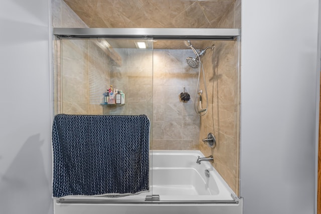 full bathroom featuring bath / shower combo with glass door