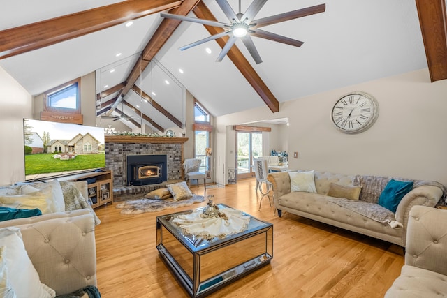 living room featuring high vaulted ceiling, ceiling fan, beamed ceiling, and recessed lighting