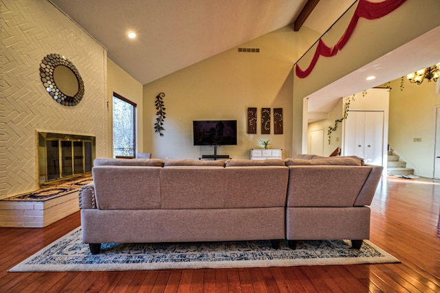3052 Westman Ct, Bloomfield Hills, MI 48304 - living area with hardwood / wood-style floors, beam ceiling, visible vents, and high vaulted ceiling