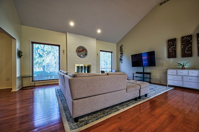 3052 Westman Ct, Bloomfield Hills, MI 48304 - living area with high vaulted ceiling, wood-type flooring, baseboards, and visible vents