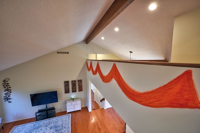 3052 Westman Ct, Bloomfield Hills, MI 48304 - living area with recessed lighting, wood finished floors, a textured ceiling, and lofted ceiling with beams