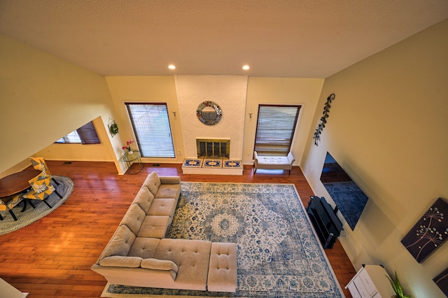 3052 Westman Ct, Bloomfield Hills, MI 48304 - living room with a fireplace, wood finished floors, and recessed lighting