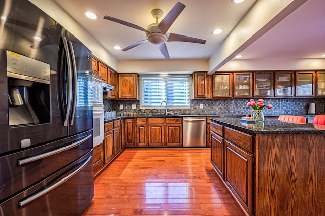 3052 Westman Ct, Bloomfield Hills, MI 48304 - kitchen featuring oven, fridge with ice dispenser, a ceiling fan, stainless steel dishwasher, and light wood-style flooring