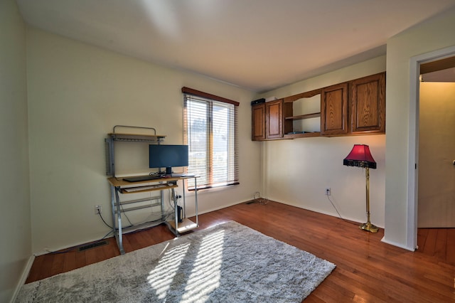 3052 Westman Ct, Bloomfield Hills, MI 48304 - home office featuring baseboards and dark wood-style flooring