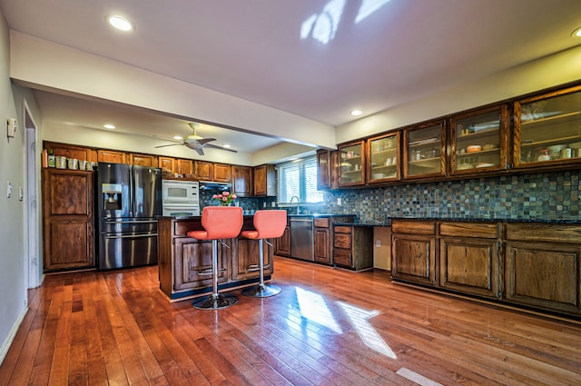 3052 Westman Ct, Bloomfield Hills, MI 48304 - kitchen featuring dark countertops, tasteful backsplash, dishwasher, white microwave, and refrigerator with ice dispenser