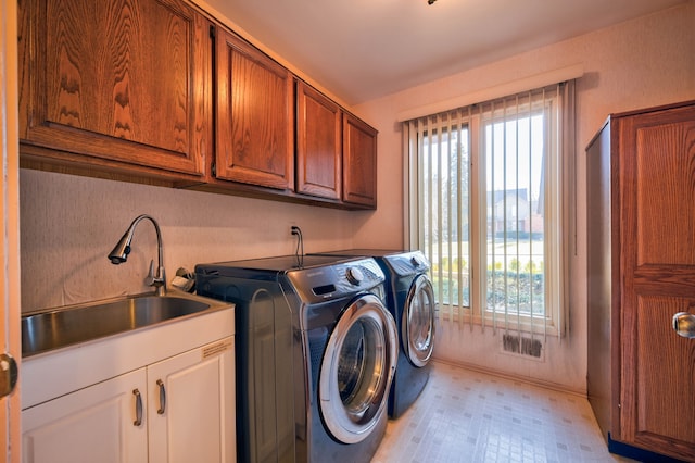 3052 Westman Ct, Bloomfield Hills, MI 48304 - laundry area featuring a sink, light floors, cabinet space, baseboards, and independent washer and dryer