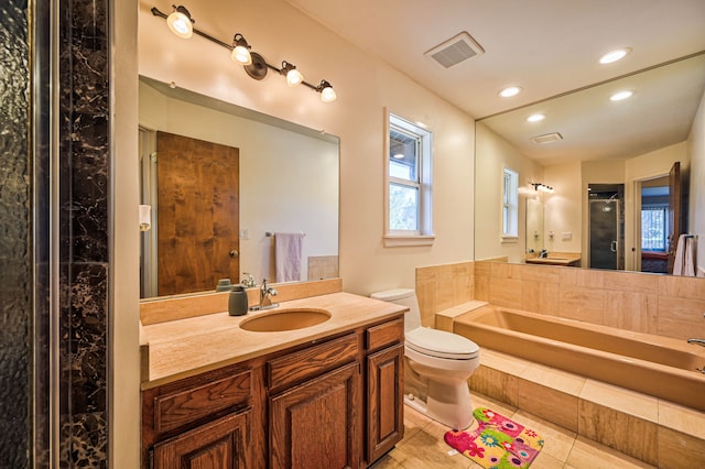 3052 Westman Ct, Bloomfield Hills, MI 48304 - full bathroom featuring tile patterned floors, a stall shower, a bath, toilet, and visible vents