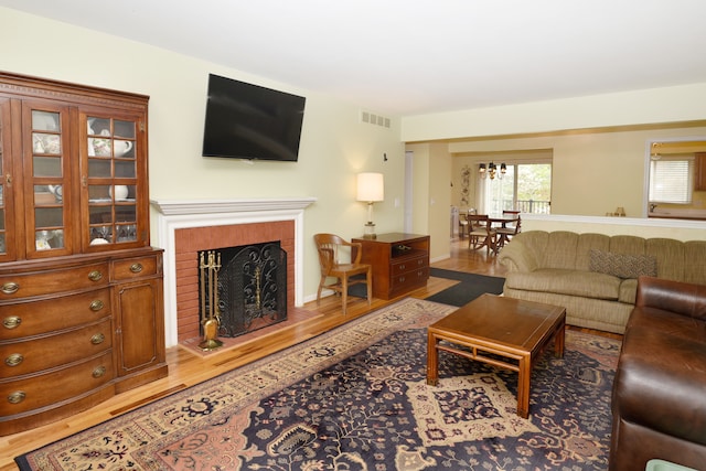 living room featuring a fireplace and wood finished floors