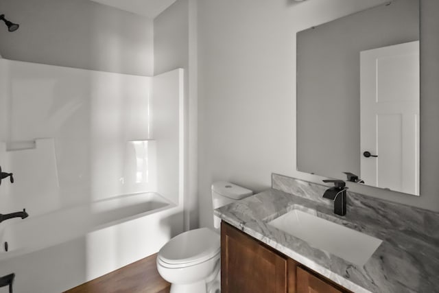10820 Baker Rd, Jerome, MI 49249 - bathroom featuring vanity, toilet, and washtub / shower combination
