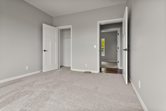 10820 Baker Rd, Jerome, MI 49249 - unfurnished bedroom featuring carpet floors, baseboards, and a closet