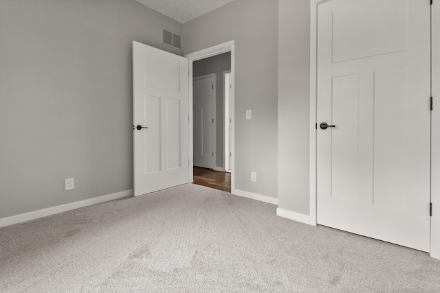 10820 Baker Rd, Jerome, MI 49249 - unfurnished bedroom with carpet floors and baseboards