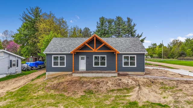 10820 Baker Rd, Jerome, MI 49249 - view of front of property with a porch and roof with shingles