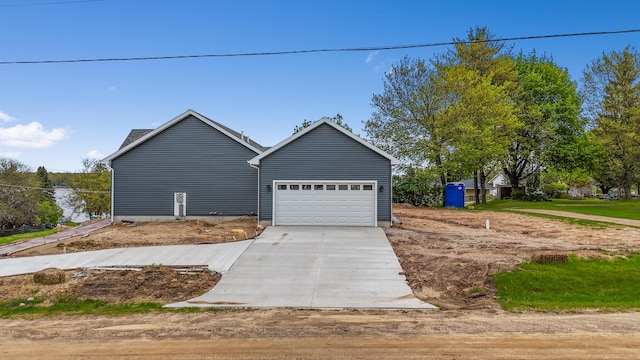 10820 Baker Rd, Jerome, MI 49249 - view of front of home with driveway and a garage