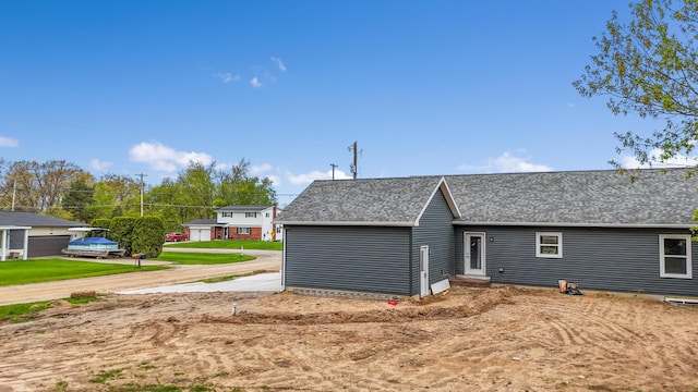 10820 Baker Rd, Jerome, MI 49249 - view of property exterior with a shingled roof