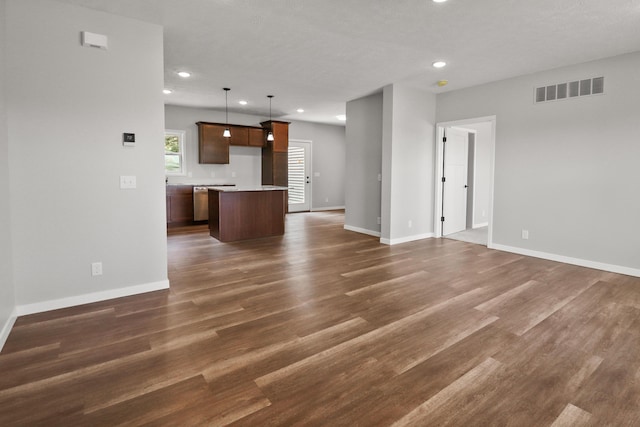 10820 Baker Rd, Jerome, MI 49249 - unfurnished living room featuring recessed lighting, baseboards, and dark wood-type flooring