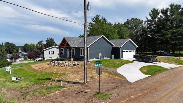 10820 Baker Rd, Jerome, MI 49249 - view of front facade with concrete driveway and an attached garage