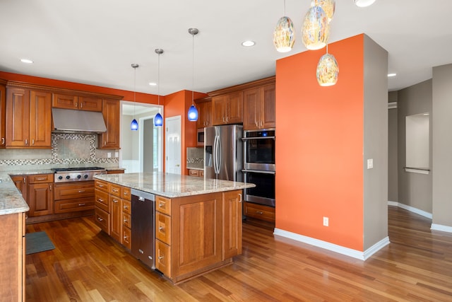24160 Argyle St, Novi, MI 48374 - kitchen featuring under cabinet range hood, appliances with stainless steel finishes, backsplash, wood finished floors, and recessed lighting