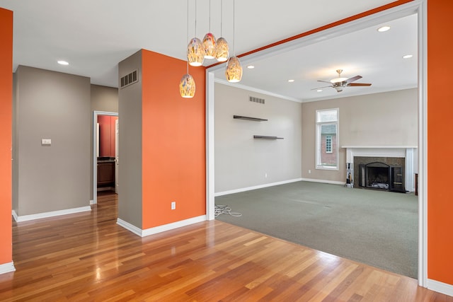 24160 Argyle St, Novi, MI 48374 - unfurnished living room with ceiling fan, baseboards, ornamental molding, recessed lighting, and wood finished floors