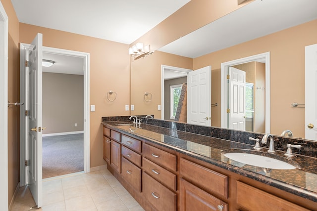 24160 Argyle St, Novi, MI 48374 - full bathroom with tile patterned flooring, double vanity, and baseboards