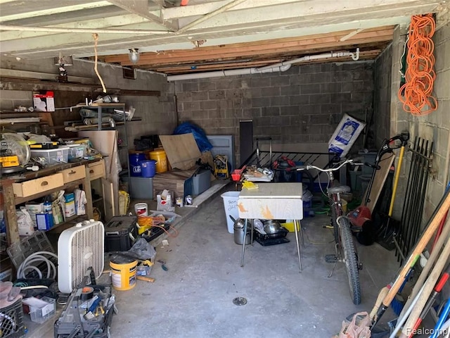 garage featuring concrete block wall