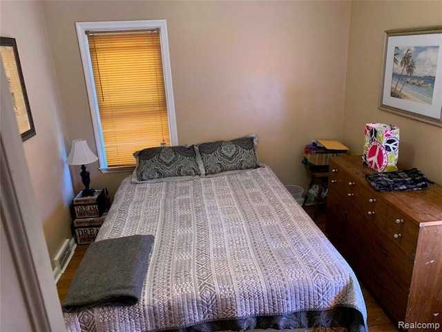 bedroom with wood finished floors