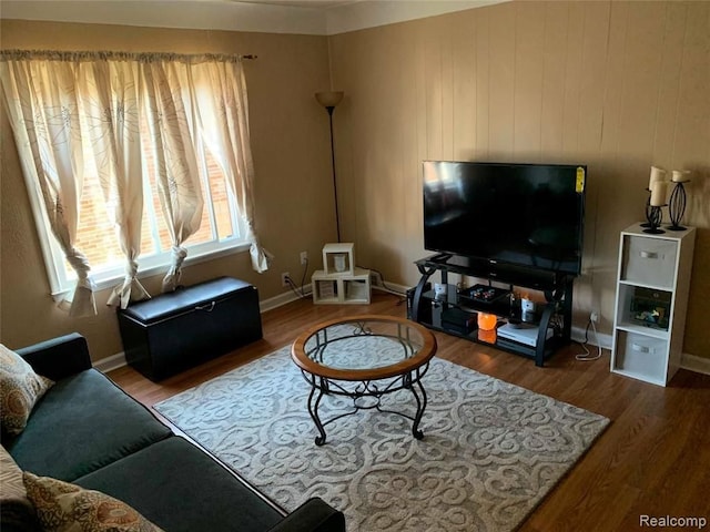living area featuring wood finished floors and baseboards