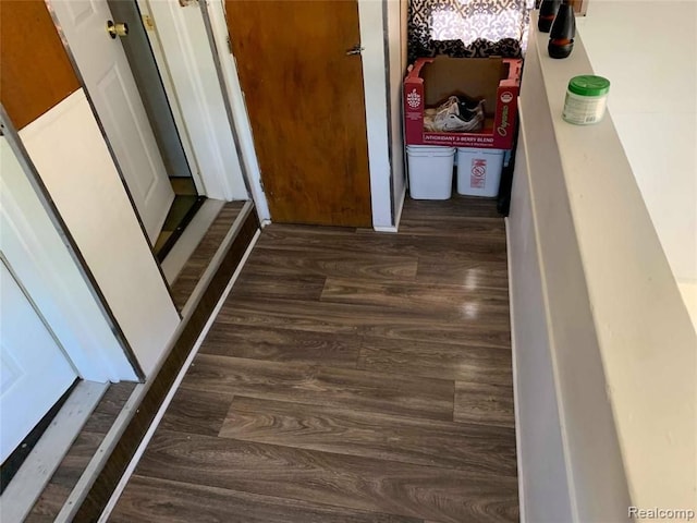 hall with wood finished floors