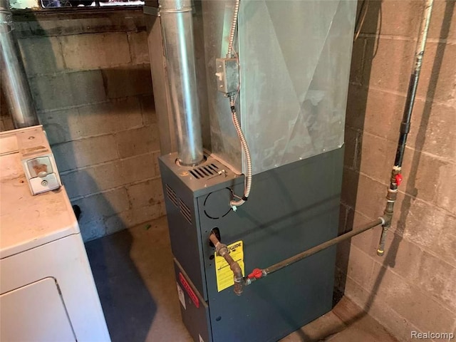 utility room with heating unit