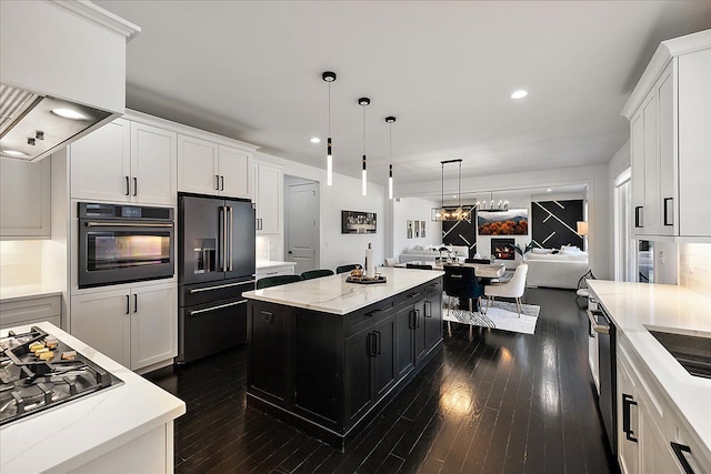 14105 Jode Park, Shelby Twp, MI 48315 - kitchen featuring appliances with stainless steel finishes, dark cabinets, open floor plan, white cabinets, and dark wood-style floors