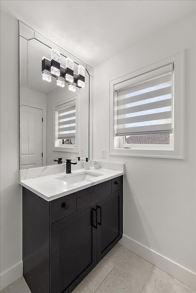 14105 Jode Park, Shelby Twp, MI 48315 - bathroom with baseboards, speckle patterned floor, and healthy amount of natural light