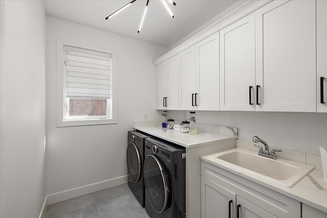 14105 Jode Park, Shelby Twp, MI 48315 - washroom with separate washer and dryer, cabinet space, and baseboards