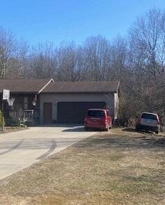 view of front of home with an attached garage and driveway
