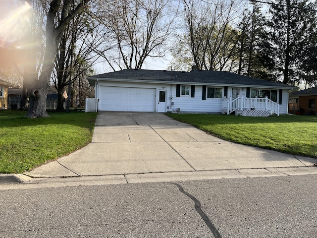 2120 Hemlock Ave, Portage, MI 49024 - ranch-style house featuring a garage, concrete driveway, and a front lawn